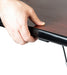 Hand gripping black table edge handle for easy lifting or height adjustment of tilt top dining table