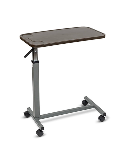 Overbed table with mahogany composite top, steel H-Base design, and four swivel casters, angled view against a plain white background