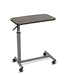 Overbed table with mahogany composite top, steel H-Base design, and four swivel casters, angled view against a plain white background