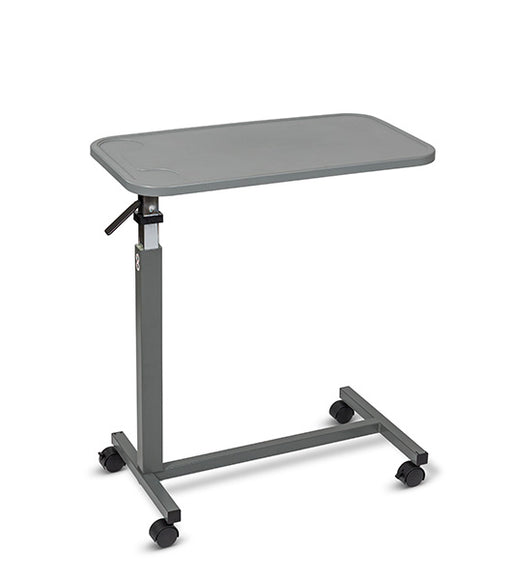 Overbed table with grey composite top, steel H-Base design, and four swivel casters, angled view against a plain white background