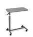 Overbed table with grey composite top, steel H-Base design, and four swivel casters, angled view against a plain white background