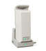 The Free Spirit Bariatric Patient Lift FS660-T stands upright in its base, with green indicator lights glowing on both the lift and the base. A coiled power cord extends from the side of the base.