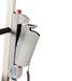 Close-up of the Free Spirit Bariatric Patient Lift FS660-T with a silver emergency stop button, gray corded handheld controller, sturdy vertical metal frame, and a 660 lb capacity power base.