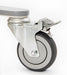A close-up of a gray and black swivel caster with metal bracket and foot brake, designed for the Free Spirit Bariatric Patient Lift FS660-T (660 lb capacity), shown against a white background.