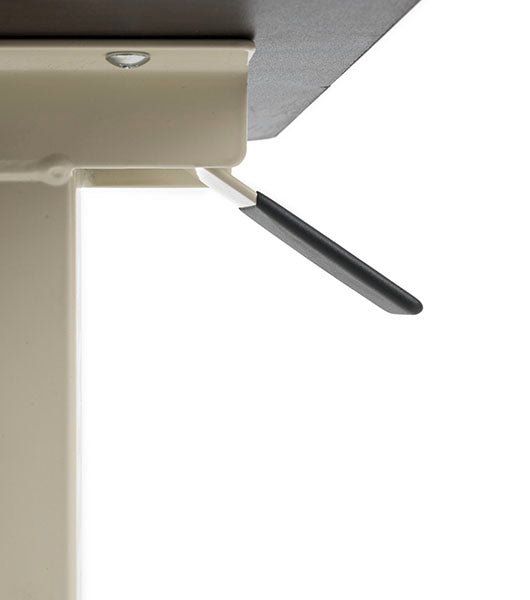 Side view of black height adjustment lever extending from white table base mechanism