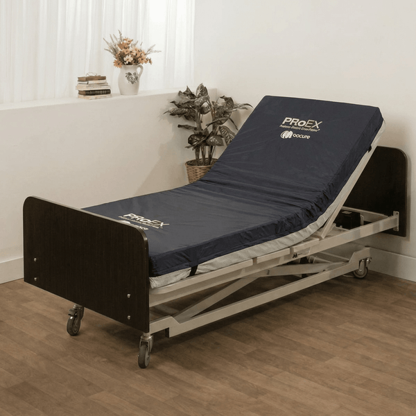 Medacure Proex Extra Long Pressure Redistribution Foam Mattress with anti-microbial cover installed on a hospital bed