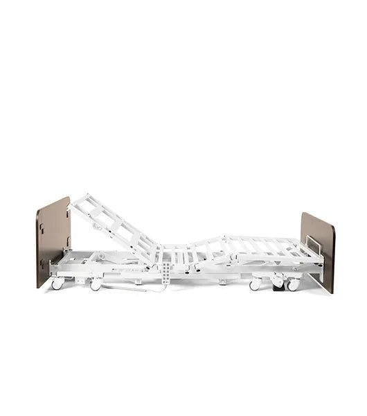 A side profile of the Medacure DLX600-CLS at a low height with the head section partially reclined and the knee section slightly raised for patient comfort.