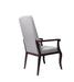 Resident arm chair for assisted living furniture - three-quarter angled view featuring light gray upholstery, high backrest, and wooden frame