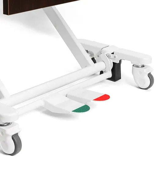 A close-up of the Medacure DLX600-CLS base frame featuring a central locking pedal system with a green "engage" indicator for the braking mechanism.