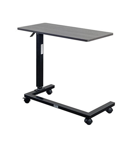 Overbed table for assisted living furniture featuring Coastal Grey surface with black height-adjustable base and four-wheel caster system