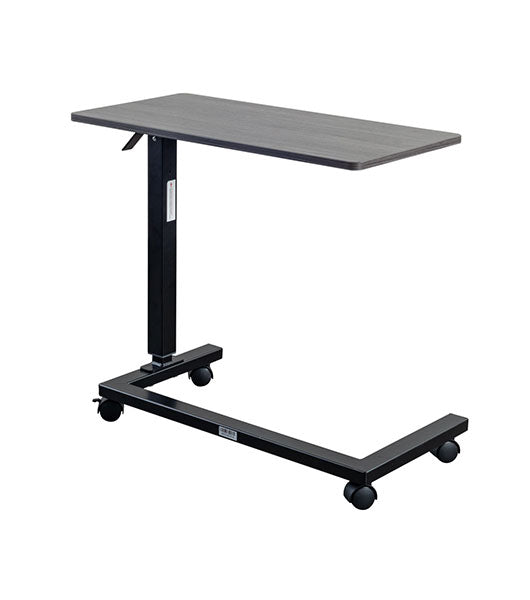 Overbed table for assisted living furniture featuring Coastal Grey surface with black height-adjustable base and four-wheel caster system