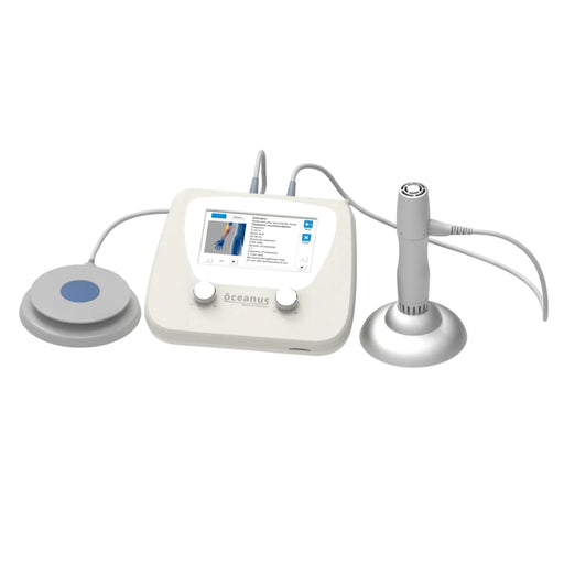 Front view of the Oceanus shockwave therapy control unit connected to the foot switch and one therapy handle resting on its pedestal.
