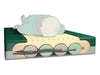 A cross-section illustration of the PressureGuard SpanCare Convertible with a patient lying on top. It highlights the interior structure, showing four large air cylinders tucked inside a foam "Safety Edge" shell, with a segmented foam topper for pressure redistribution.