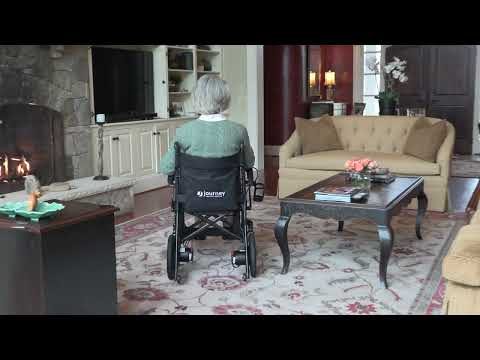 A video showcasing an elderly woman riding the Journey Air Elite Power Chair indoors.