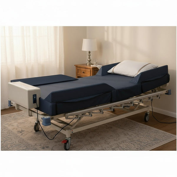 The Protekt Aire 4000DX mattress system on a hospital bed base. The dark blue mattress is partially articulated (raised head section), clearly showing the raised side rails. The digital pump unit is attached to the foot of the bed. 