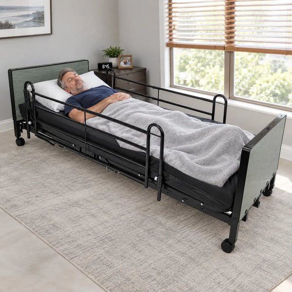 Man sleeping peacefully in Protekt Akra-FE full-electric hospital bed with full rails in modern home bedroom