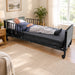 Man resting comfortably in Protekt Akra-FE full-electric hospital bed in modern home bedroom setting