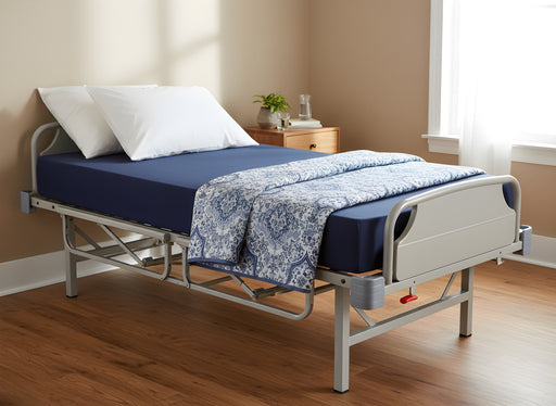 Proactive Protekt Fiber Mattress on a hospital bed with blue and white patterned bedding in a well-lit room with wood flooring