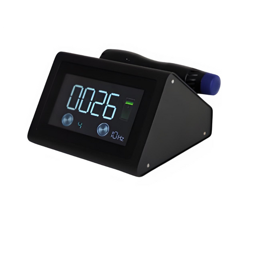 A slightly angled view of the Radialspec Neo displayed against a plain white background. The device is a compact, black wedge-shaped unit featuring a large digital display showing "0026," a frequency setting of "10Hz," and a green battery indicator. A black handpiece with a blue applicator tip is docked horizontally on the top-rear cradle.