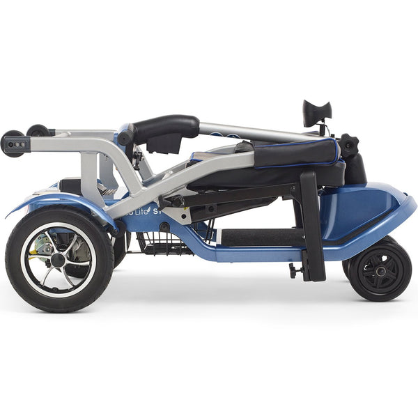 A side profile of the blue Journey So Lite® scooter in its fully collapsed, folded position. The tiller and seat are folded flat against the frame, highlighting its compact, low-profile shape for storage.