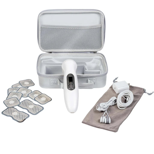 Complete Oceanus Stimsonic therapy kit showing open carrying case with device, TENS electrode pads, charging cables, power adapter, and storage pouch