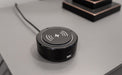 Close-up of a black voice actuation device with type-C and USB port