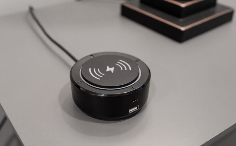 Close-up of a black voice actuation device with type-C and USB port